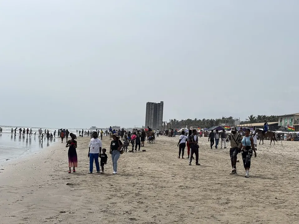 Visitors on the sand at Labadi Beach, Accra