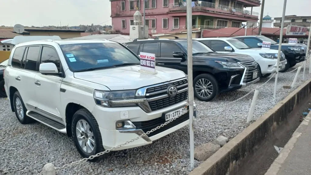 Ogazy G Car Rental - cars in the yard