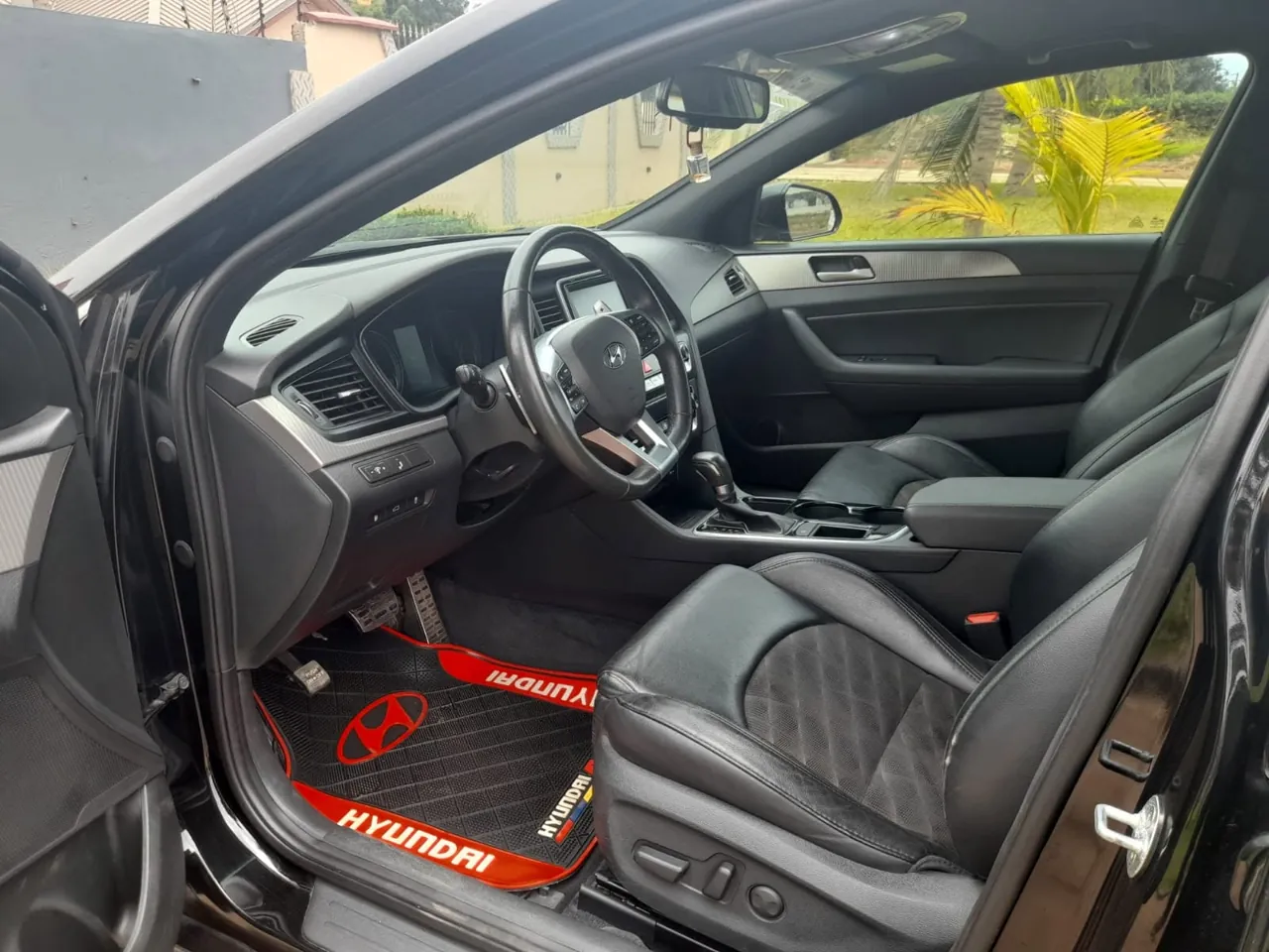 Ovvadrive Car Rental - Hyundai Sonata interior, black leather seats